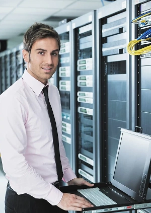 businessman-with-laptop-network-server-room-scaled-2_11zon